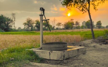 vintage water pump on a farmland